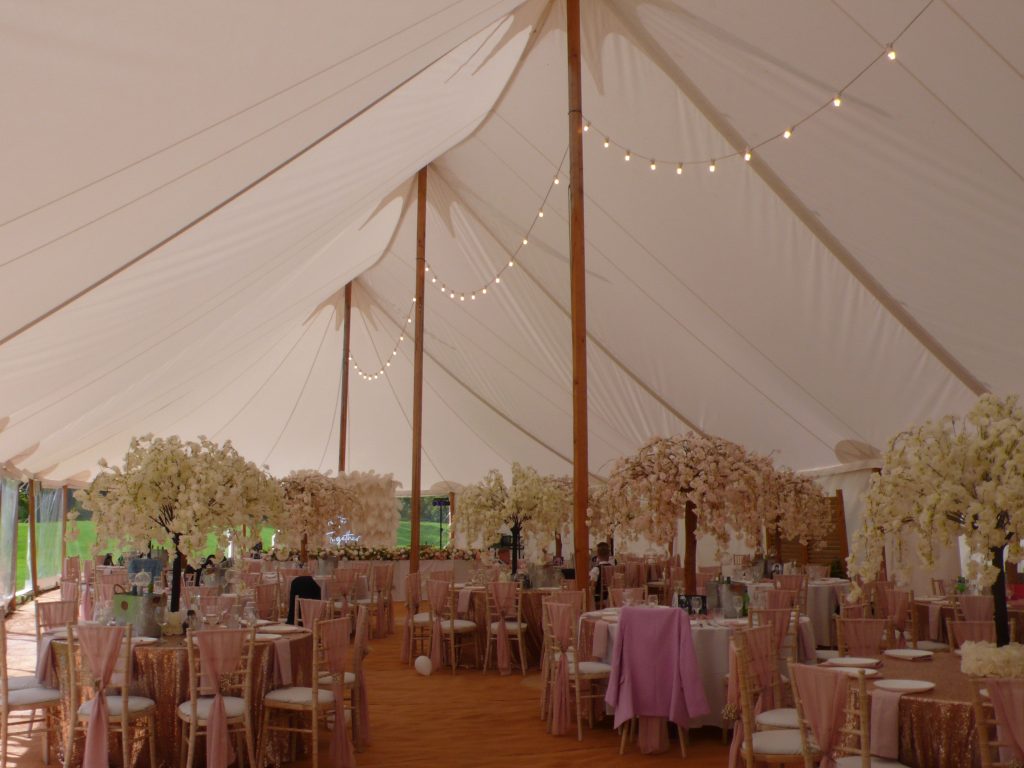 Marquee interior with fairy lights and elegant wedding décor
