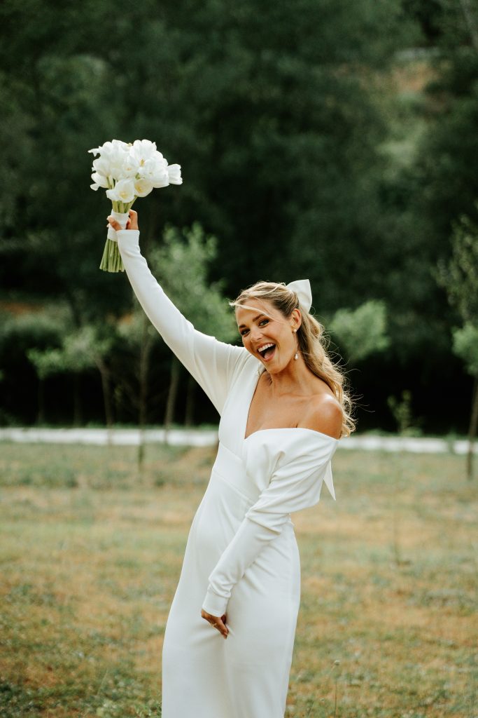 Bride holding her wedding bouquet before the bouquet toss