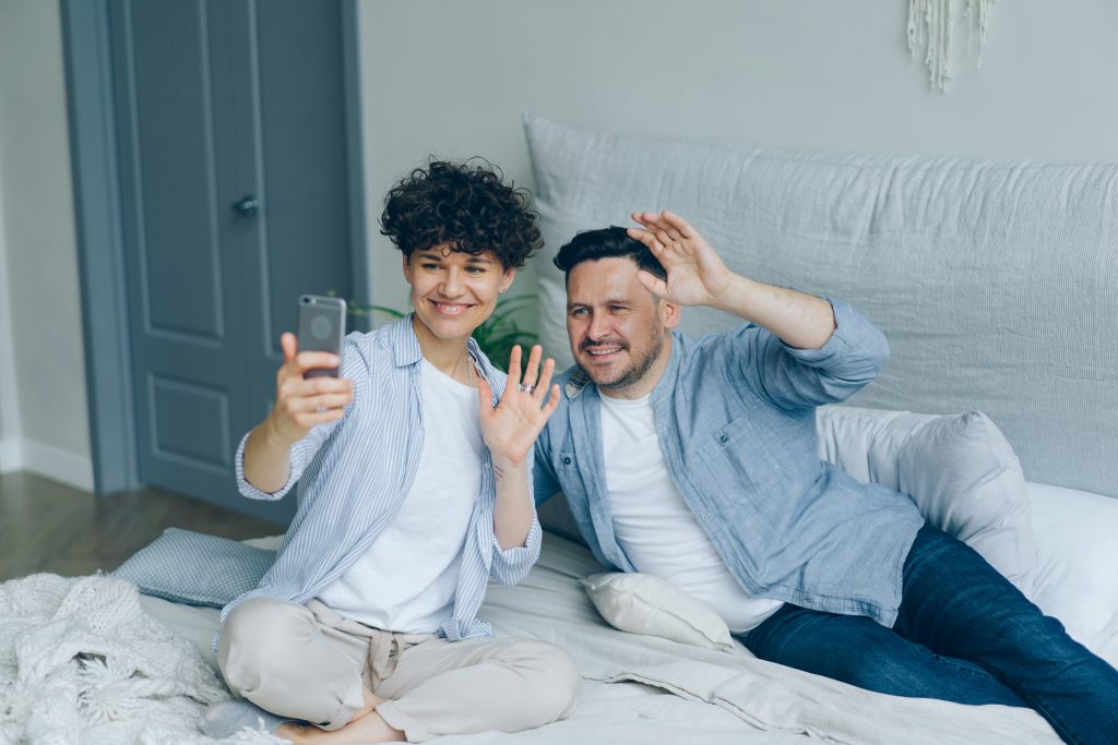 Couple making celebratory calls
