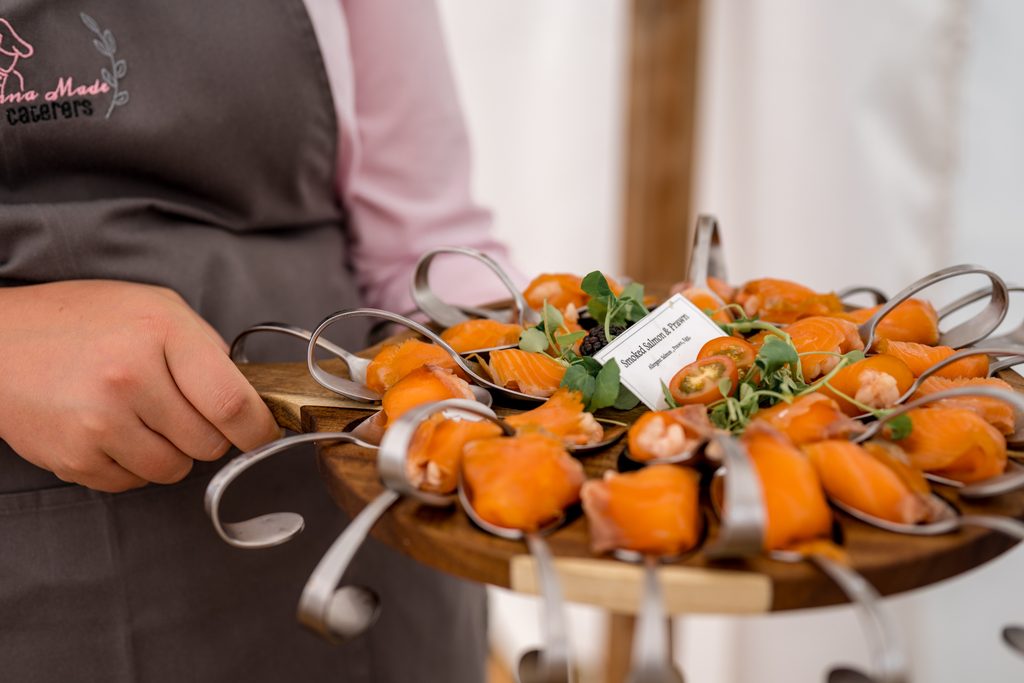 Guests enjoying canapes outdoors